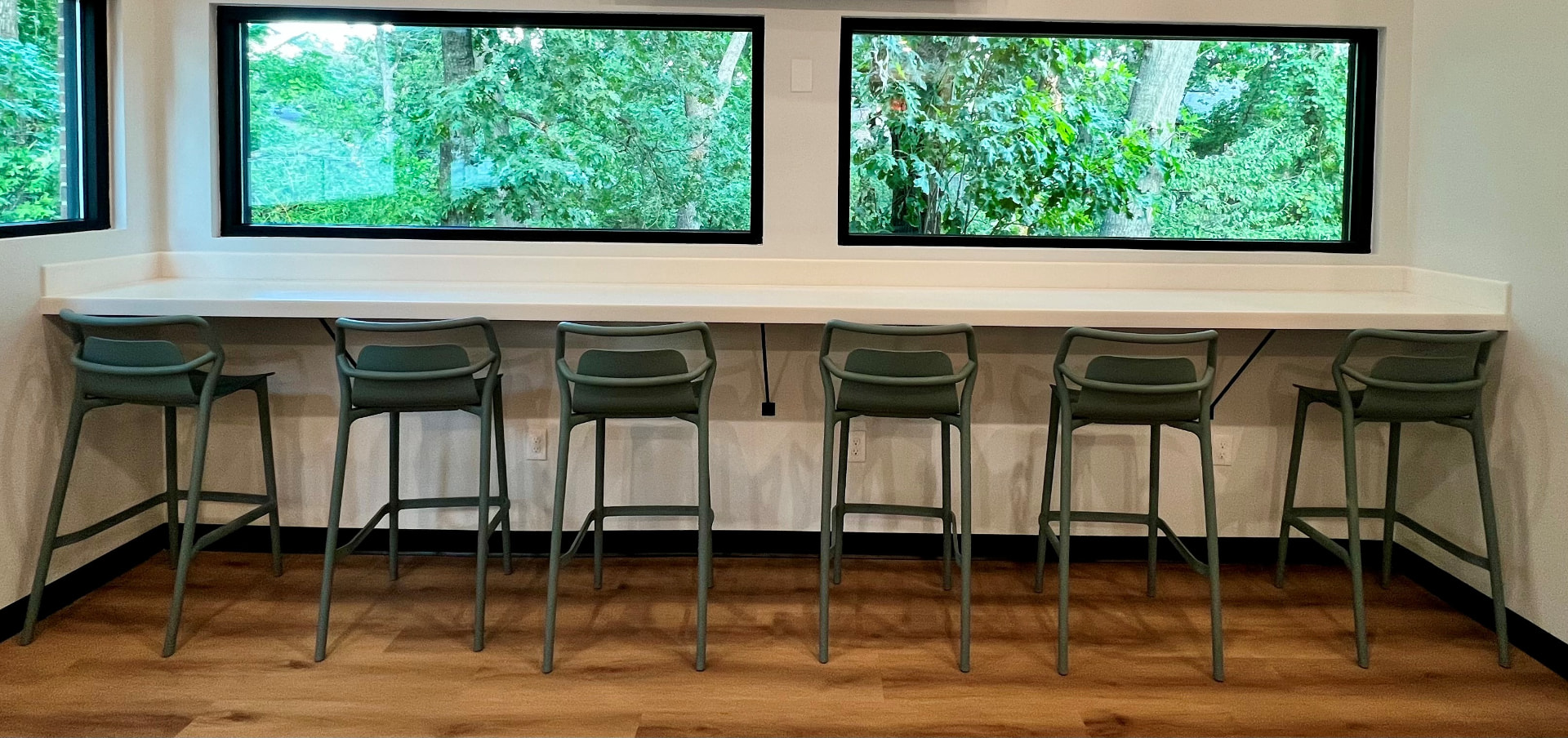 The Dallas Therapy Associates breakroom with counter seating and windows overlooking greenery
